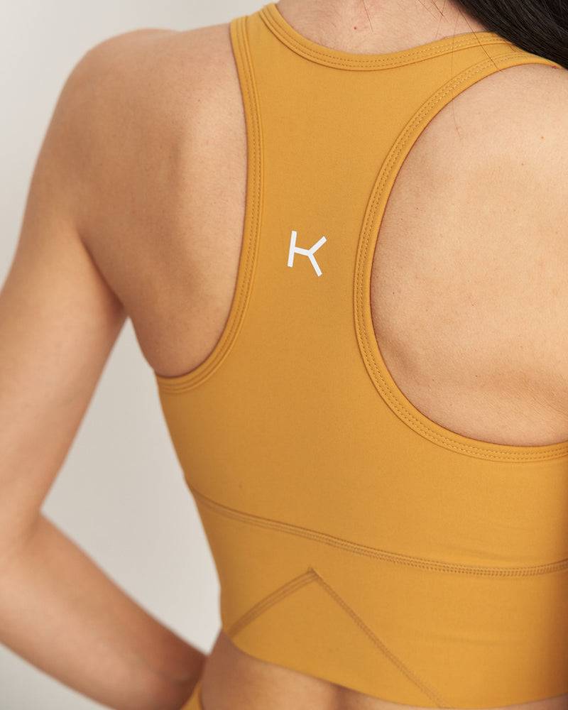 Kuuno Essential Movement Bra Spicy Pumpkin Fabrikverkauf